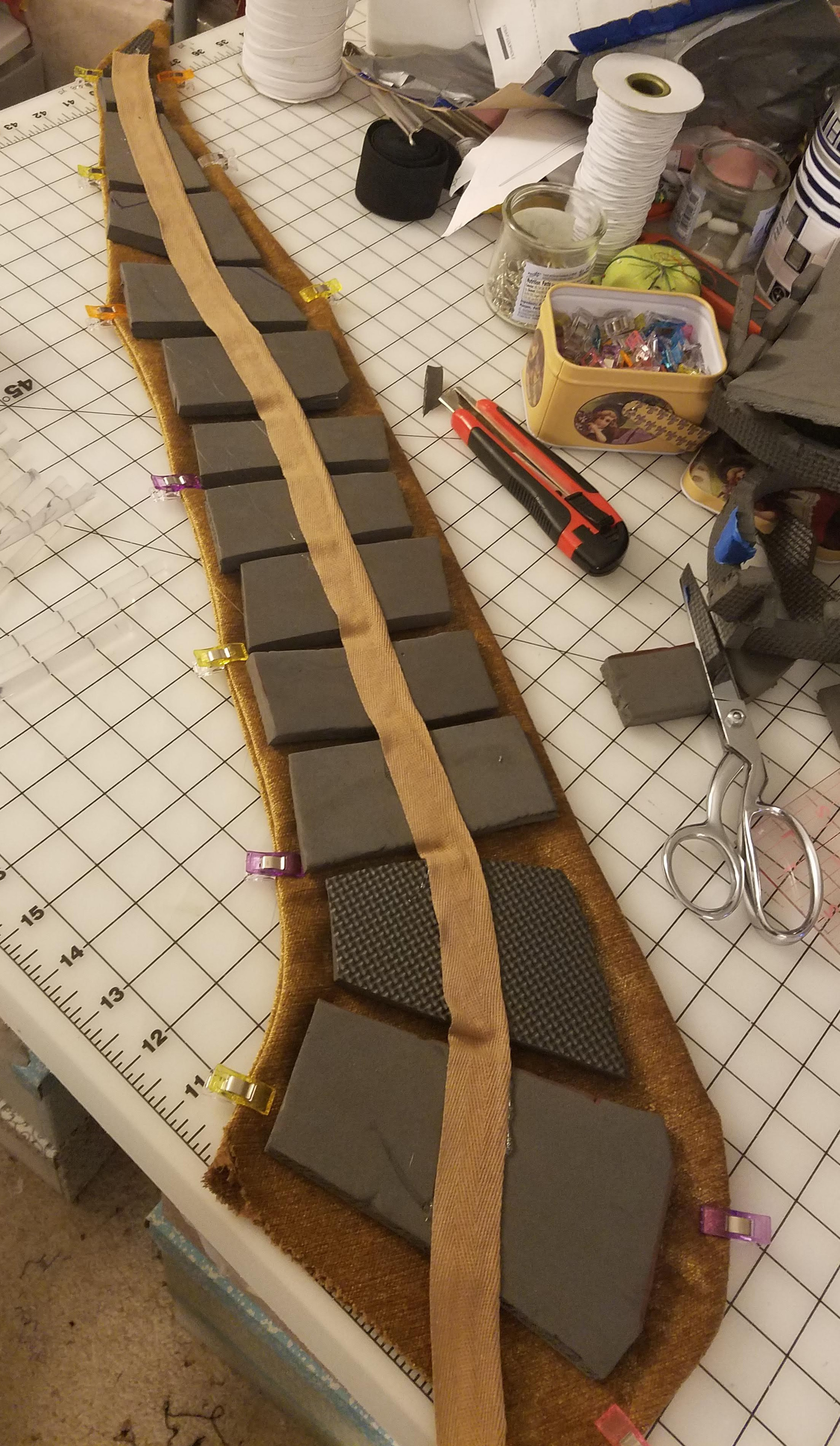 alt: Close-up of shoe covers and bracers for the Halloween costume.