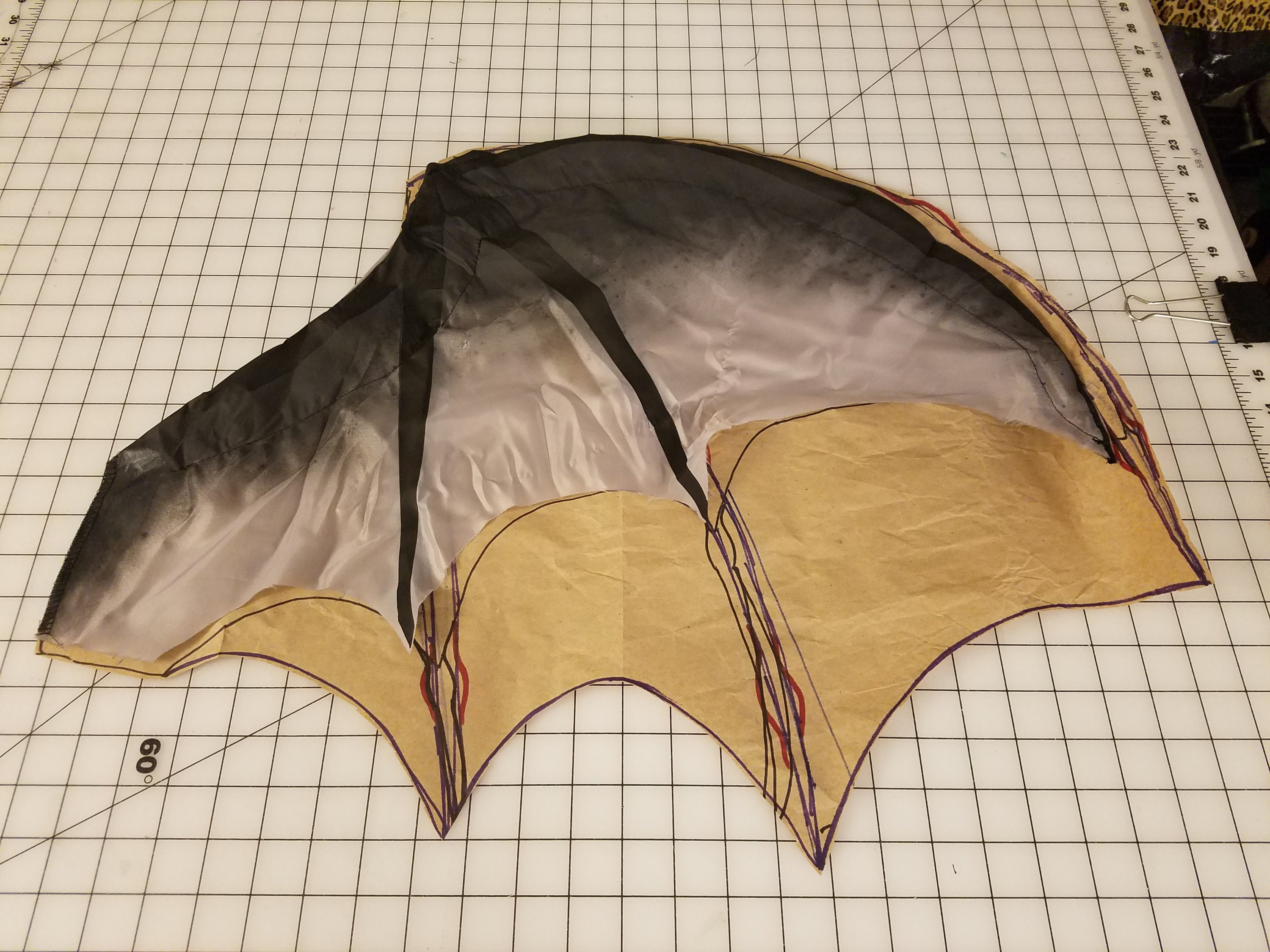 alt: Various stages of crafting a DIY Halloween costume, focusing on wings and other details.